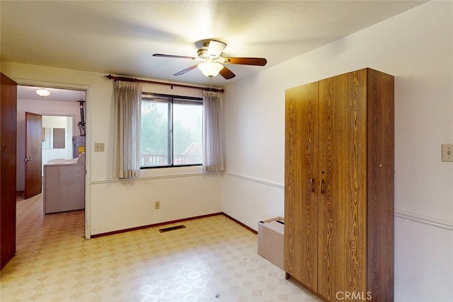 unfurnished bedroom featuring ceiling fan and a textured ceiling