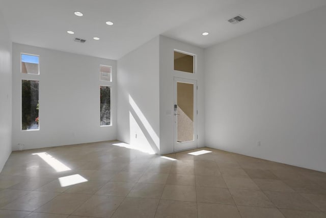 unfurnished room featuring light tile patterned floors