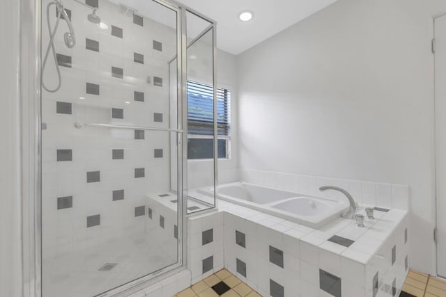 bathroom featuring separate shower and tub and tile patterned flooring