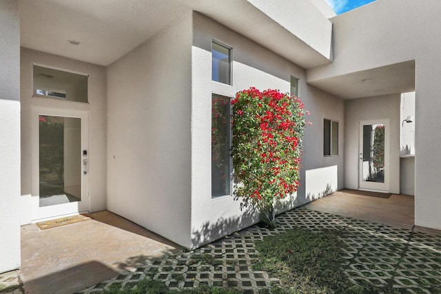 doorway to property with a patio