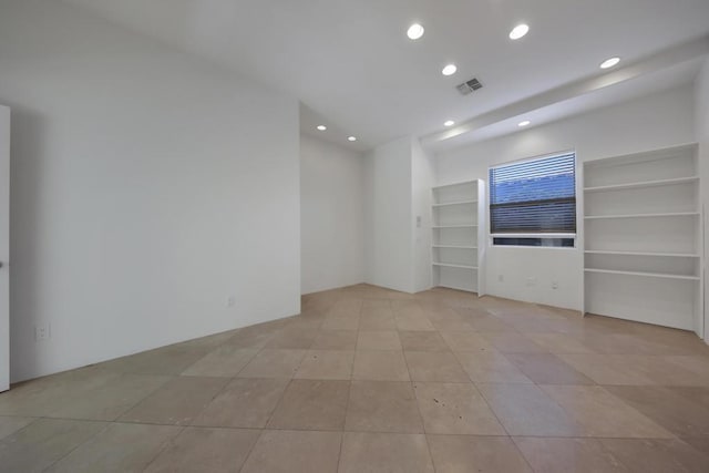 unfurnished living room with light tile patterned flooring