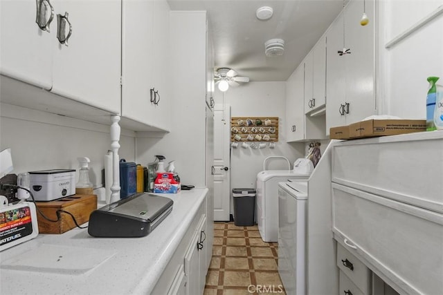 laundry area featuring ceiling fan and washing machine and dryer