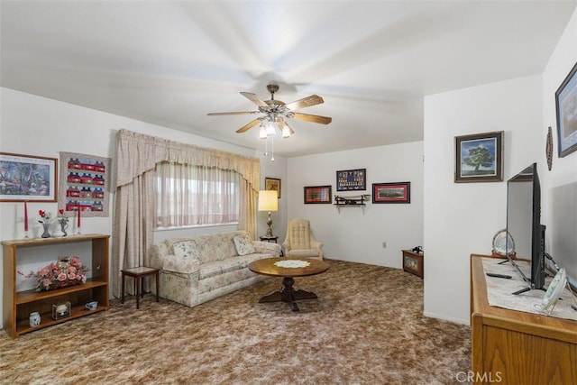 carpeted living room with ceiling fan