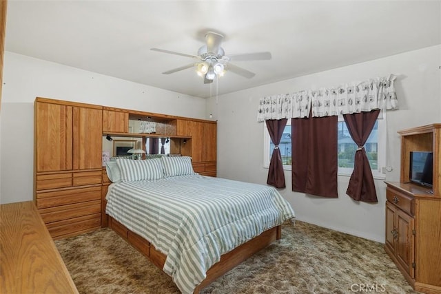 bedroom with ceiling fan and light carpet