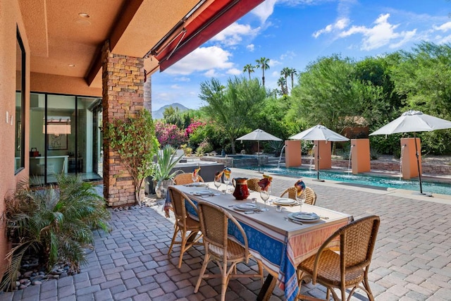 view of patio with pool water feature