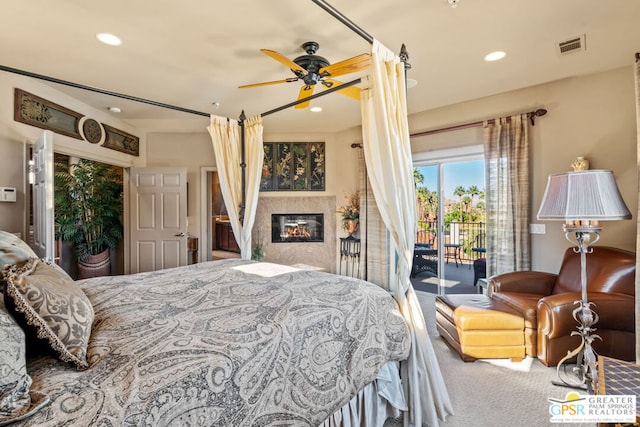 carpeted bedroom featuring access to exterior and ceiling fan