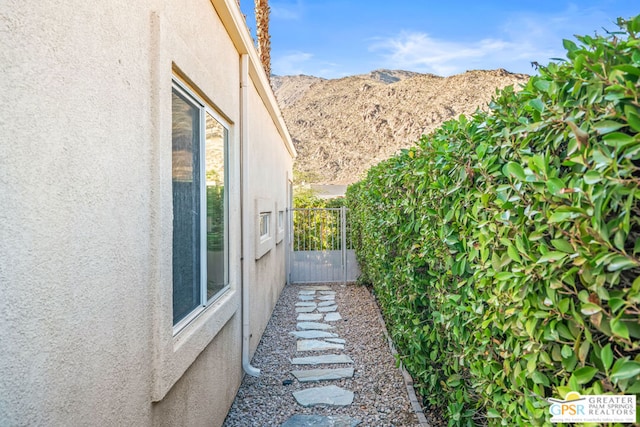 view of home's exterior with a mountain view