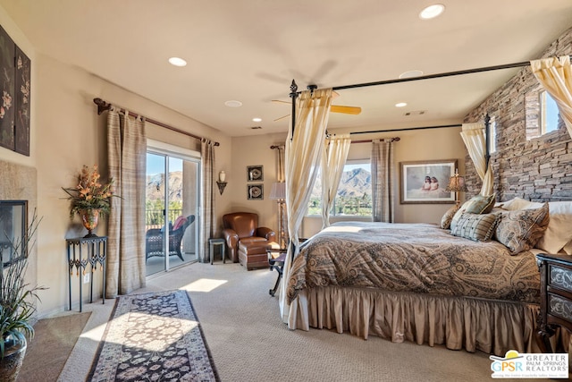 bedroom featuring light carpet and access to exterior