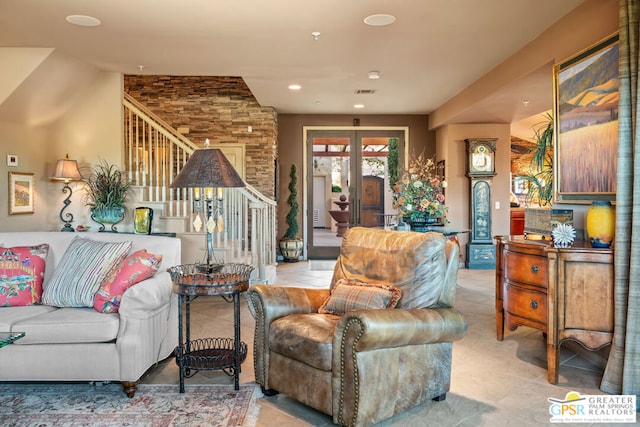 living room featuring french doors and light tile patterned floors