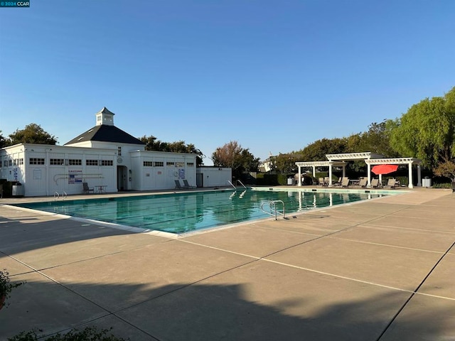 view of pool with a patio area and a pergola