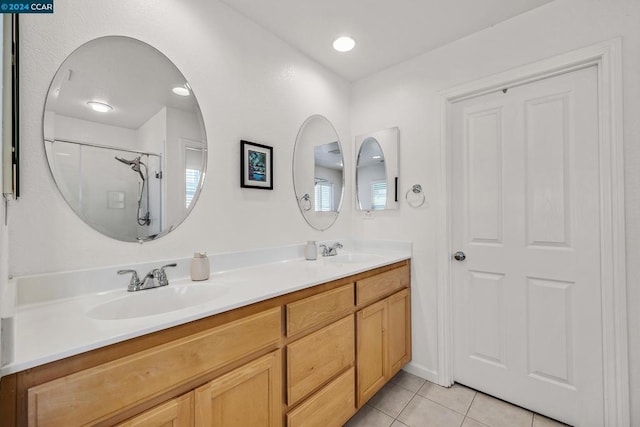 bathroom with vanity, a shower, and tile patterned flooring