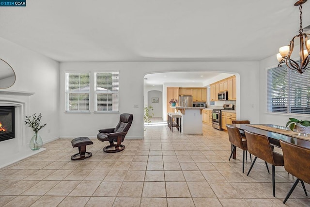 interior space featuring a chandelier and light tile patterned floors