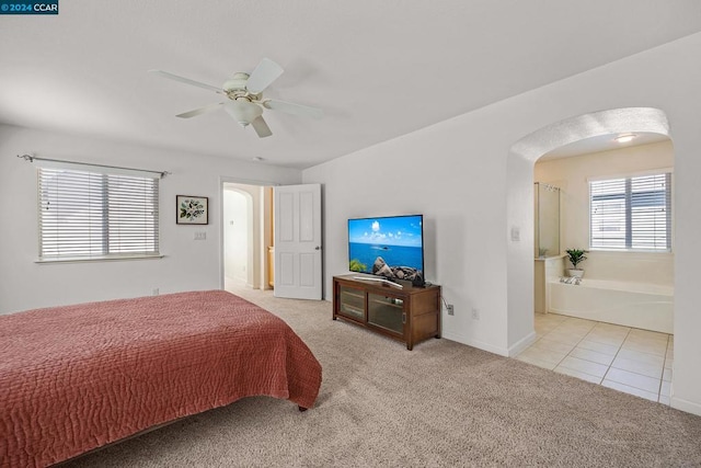 bedroom featuring light carpet and ceiling fan