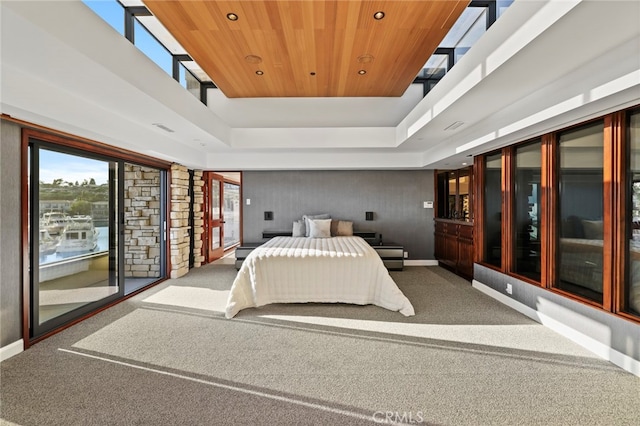 carpeted bedroom with wooden ceiling