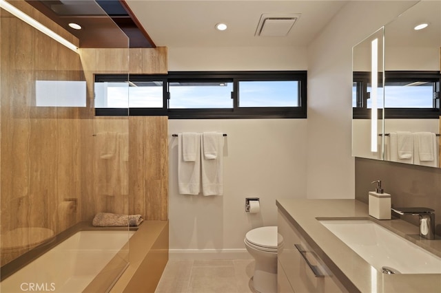 bathroom featuring vanity, toilet, and tile patterned floors