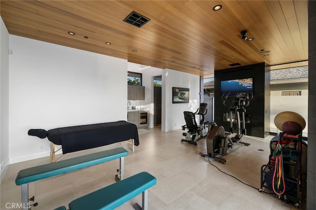 workout area with wood ceiling