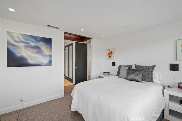 bedroom featuring light carpet