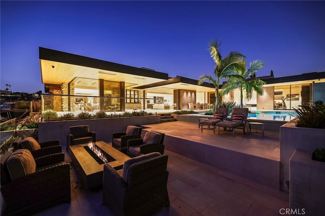 view of patio terrace at dusk