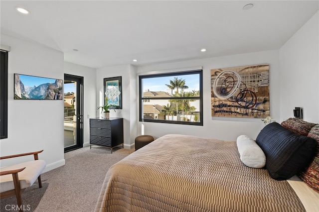 bedroom featuring light carpet and access to exterior