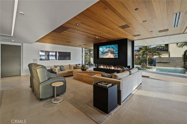 living room with wooden ceiling and expansive windows