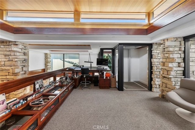 interior space featuring carpet flooring and wooden ceiling