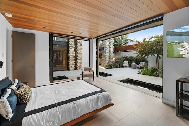 bedroom featuring floor to ceiling windows, wood ceiling, and a water view