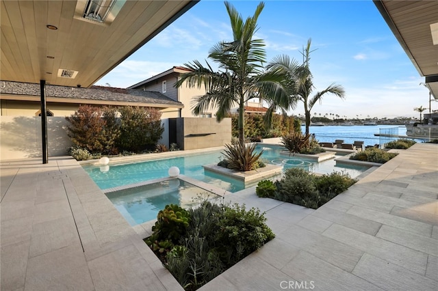 view of swimming pool featuring a patio, an in ground hot tub, and a water view