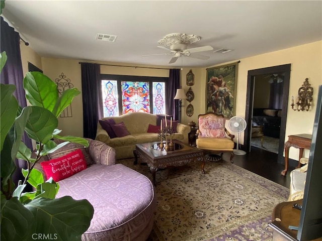 living room with ceiling fan and wood-type flooring