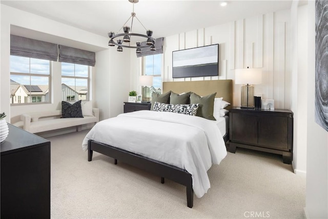 bedroom with carpet flooring and an inviting chandelier