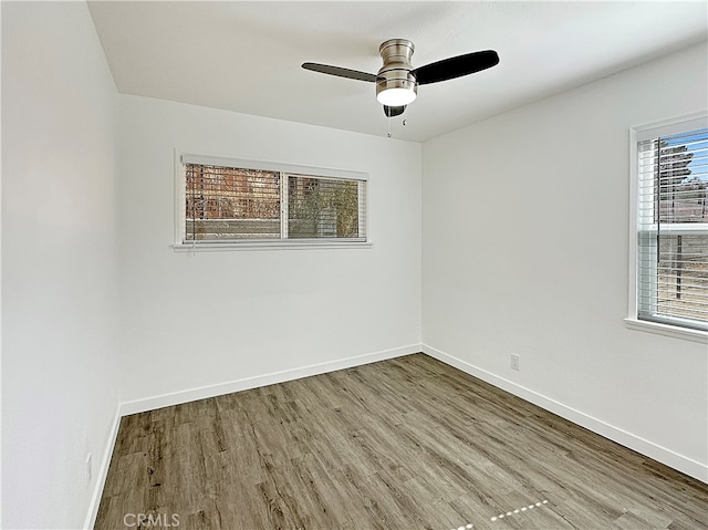 spare room with ceiling fan and light hardwood / wood-style flooring