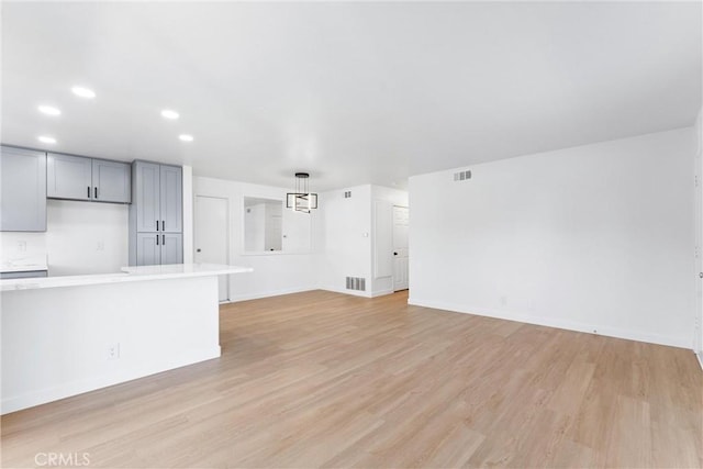 unfurnished living room with light wood-type flooring