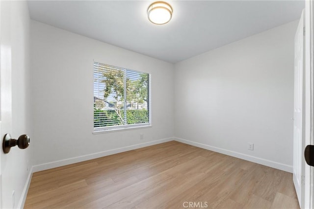 empty room with light wood-type flooring