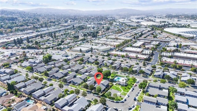 birds eye view of property featuring a mountain view