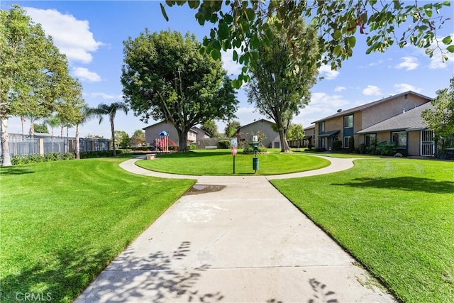 view of property's community with a yard