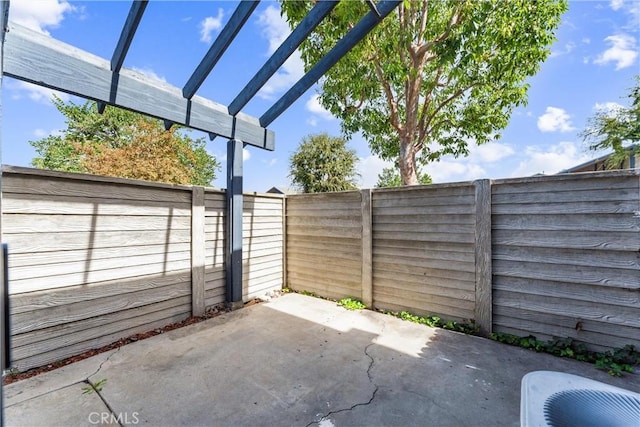 view of patio with a pergola and central AC