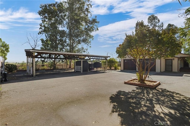 exterior space featuring a carport and a garage