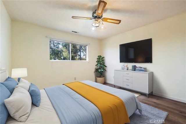 bedroom featuring ceiling fan and hardwood / wood-style floors