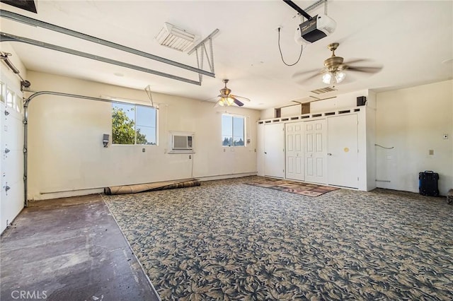 garage with ceiling fan and a garage door opener