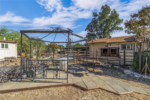 view of patio / terrace with an outbuilding