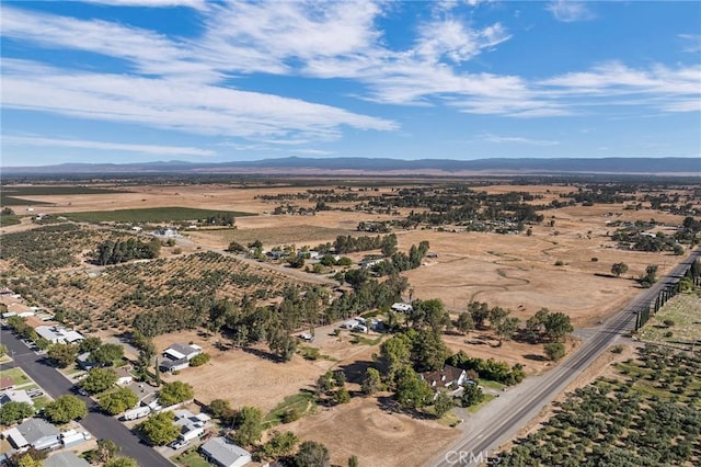 drone / aerial view featuring a mountain view and a rural view