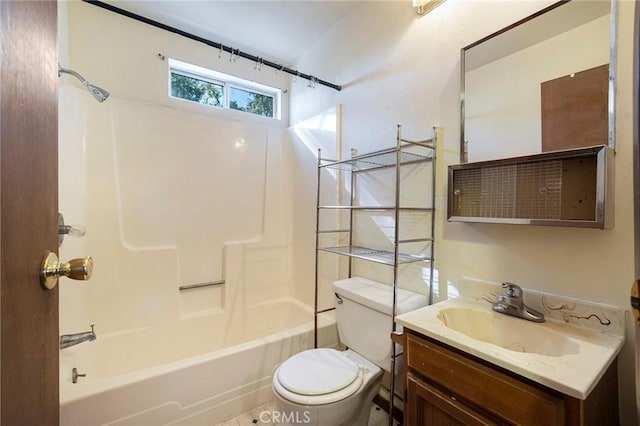 full bathroom featuring tile patterned flooring, toilet, vanity, and washtub / shower combination