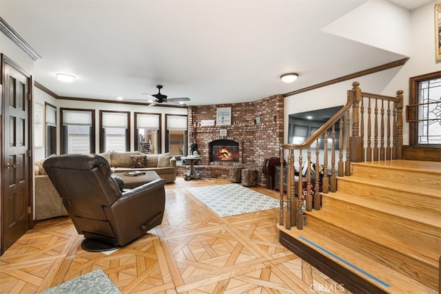 living room featuring a fireplace, light parquet floors, plenty of natural light, and ceiling fan