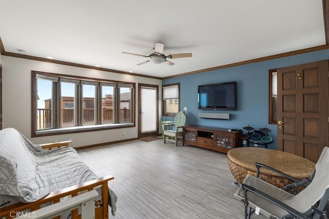 living room with crown molding and ceiling fan