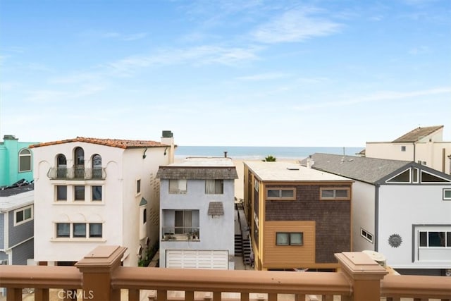 rear view of property with a water view