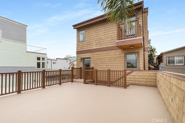 rear view of property featuring a patio