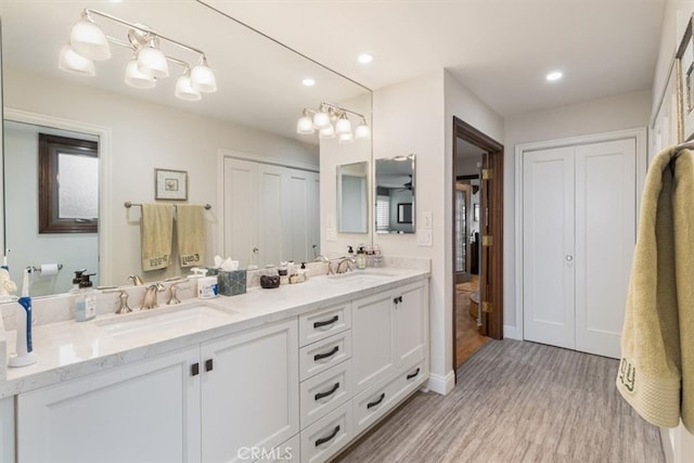 bathroom featuring vanity and hardwood / wood-style floors