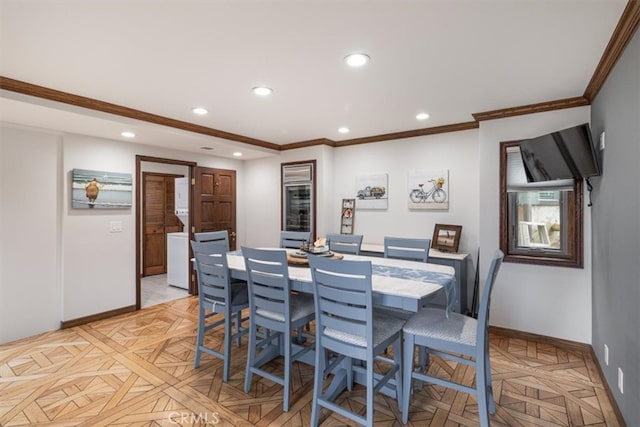 dining space with ornamental molding and light parquet floors