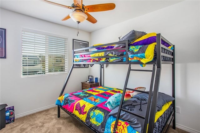 bedroom with ceiling fan and carpet floors