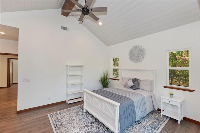 bedroom with hardwood / wood-style floors, ceiling fan, and high vaulted ceiling