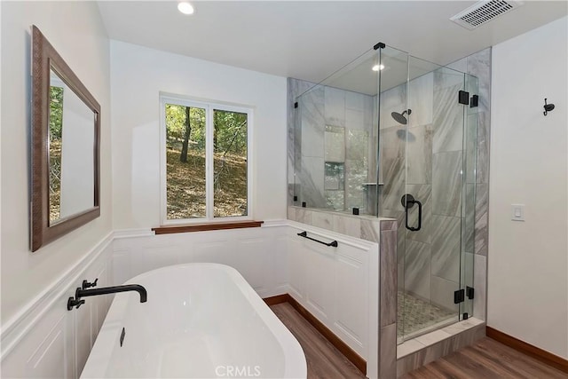 1285 N State Highway 173, Lake Arrowhead, CA 92352 - full bath with a freestanding bath, wood finished floors, a stall shower, recessed lighting, and a wainscoted wall